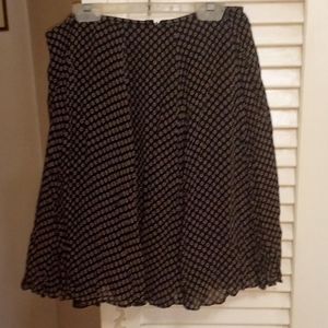 From Anita's Closet DKNY, size 10, Black and Gold floral mini  skirt